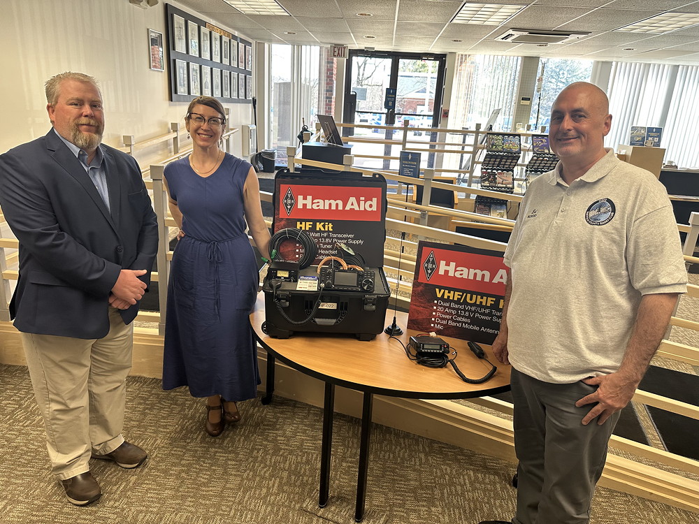 Josh Johnston, KE5MHV, Director of Emergency Management, briefing Rosy Schechter, KJ7RYV, and Ed Wilson, M17, on the American Radio Relay League (ARRL) Ham Aid Program