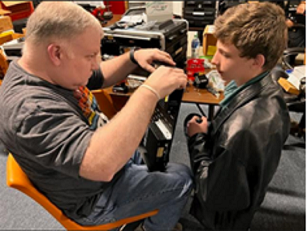 Grantees from the York Amateur Radio Club (YARC): Mark Pritchard N4MCP and Ephraim Pritchard K4EBP inspecting their work before their next assembly steps for their Go-Boxes.